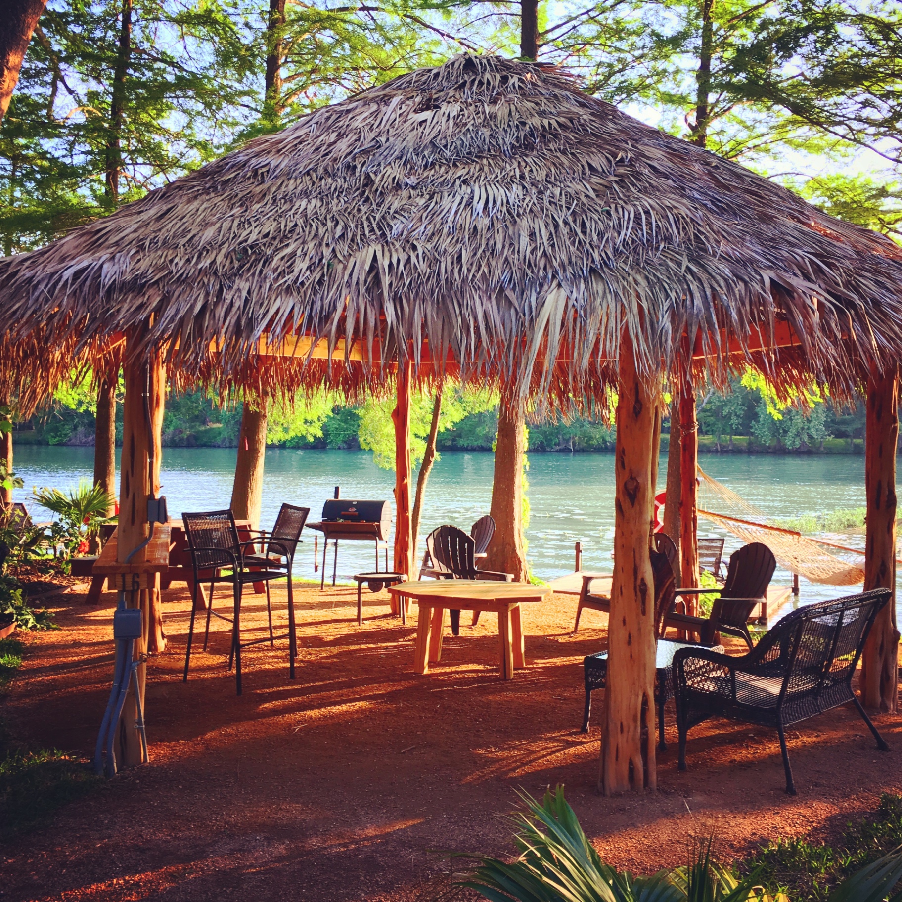 Cabana interior with seating and lake view