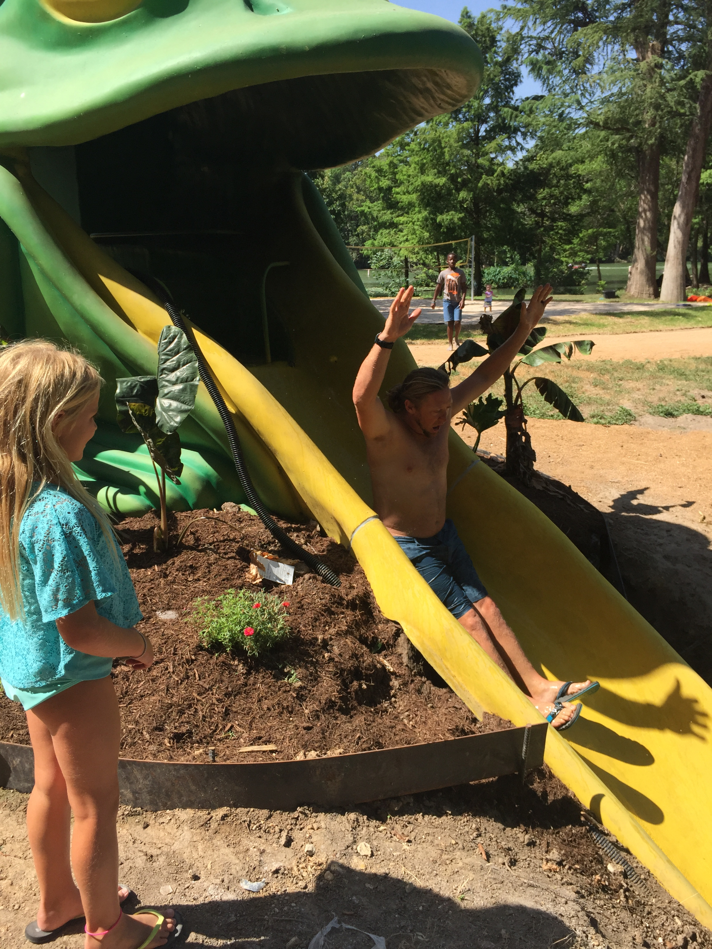 Kids on the waterslide at Son's Island near San Antonio