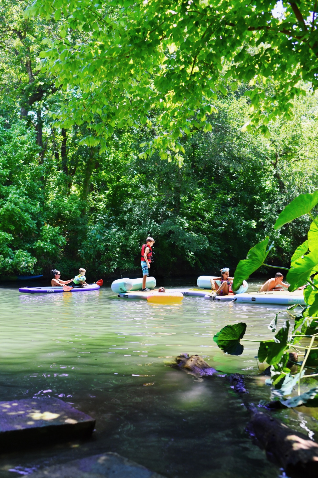 Family floating on the creek
