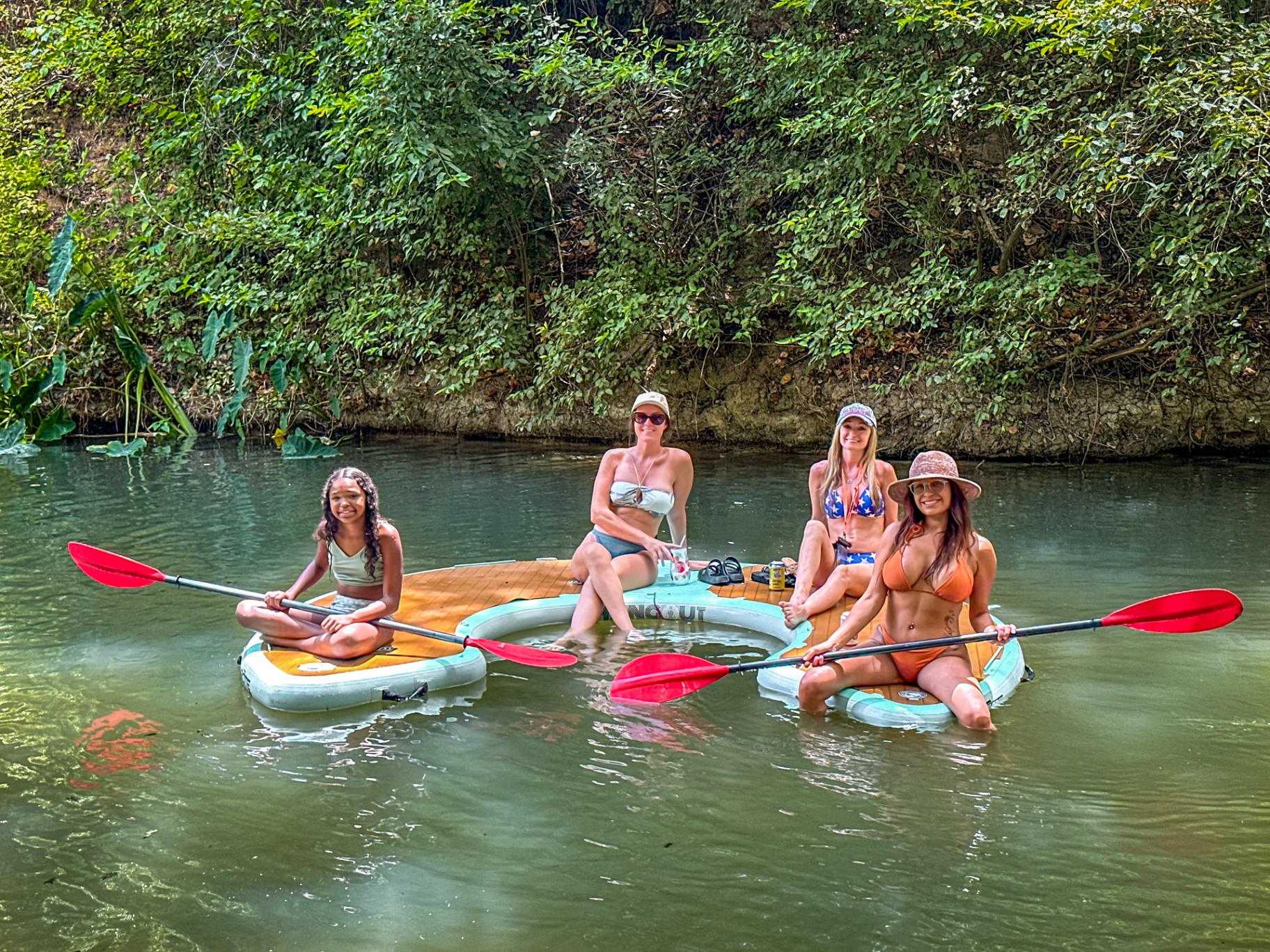 Girlfriends paddleboarding