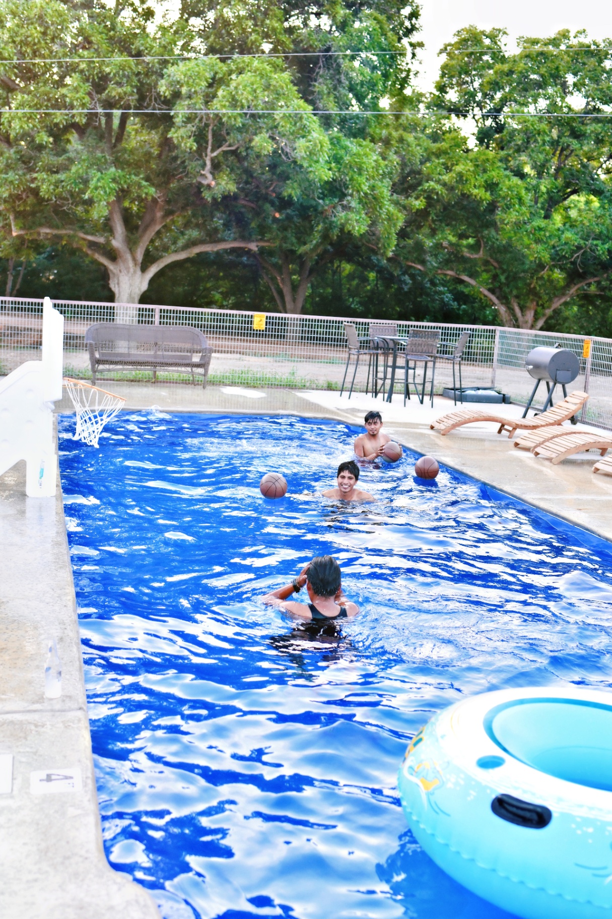 Kids playing basketball in the pool